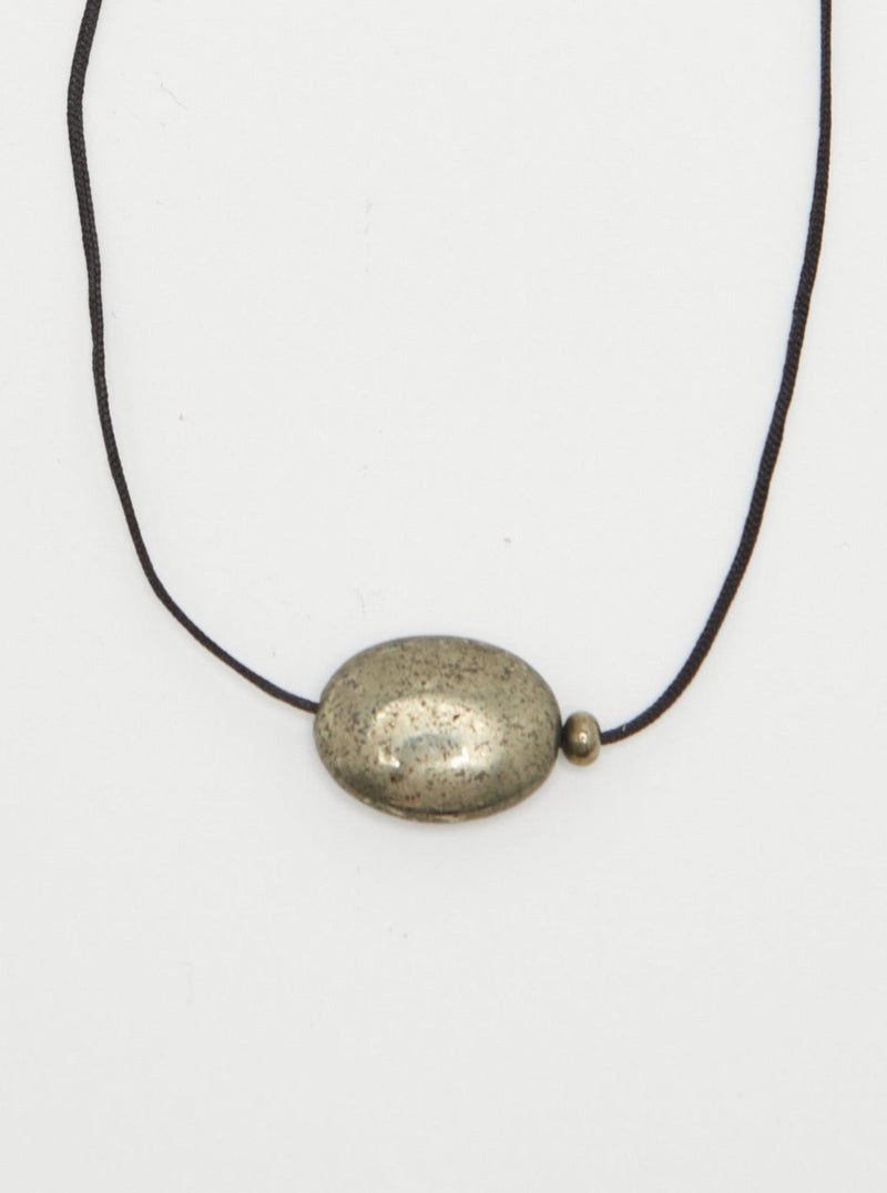 Oval Pyrite Necklace necklace close up flat lay