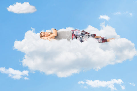 Woman sleeping on a cloud