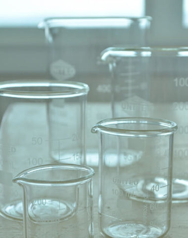 Empty glass beakers to make goat milk lotion with