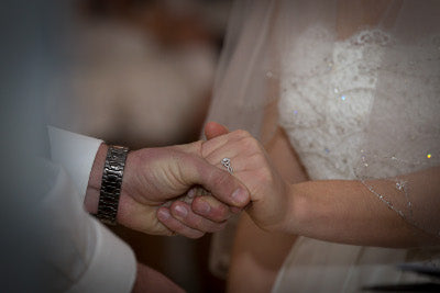 Hands of husband and wife with rings