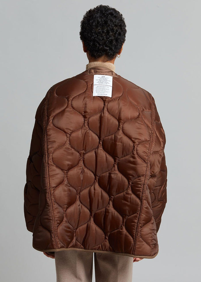 https://cdn.shopify.com/s/files/1/1527/0993/products/teddy-quilted-jacket-chocolate-jacket-the-frankie-shop-882796_700x.jpg?v=1629631440