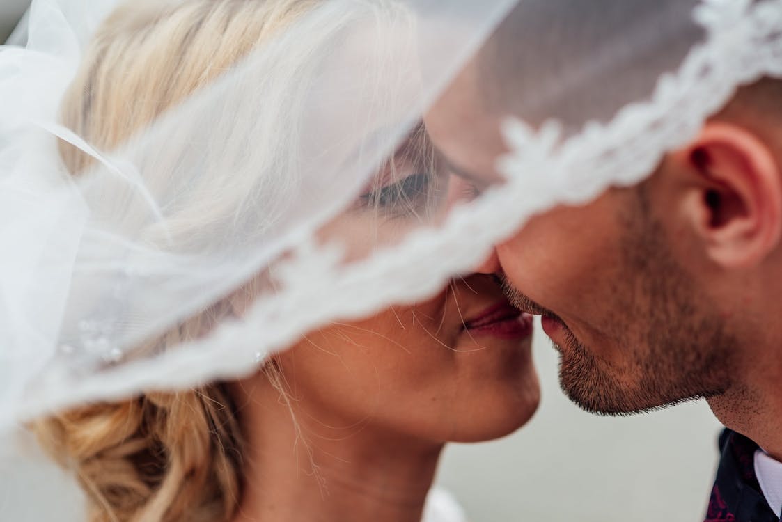 https://www.pexels.com/photo/groom-and-bride-kissing-1589818/