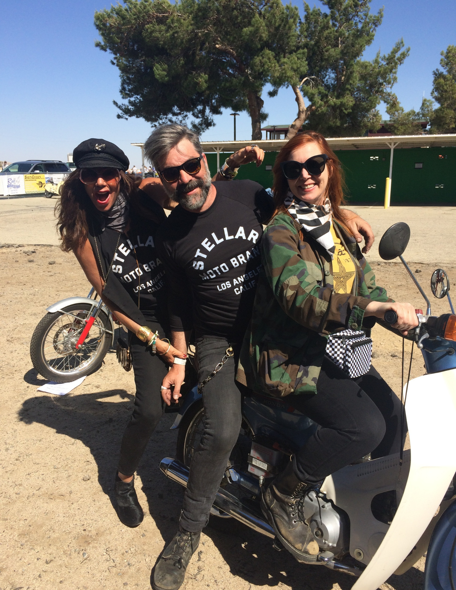 Three friends wearing Stellar Moto Brand T-shirts on a moped