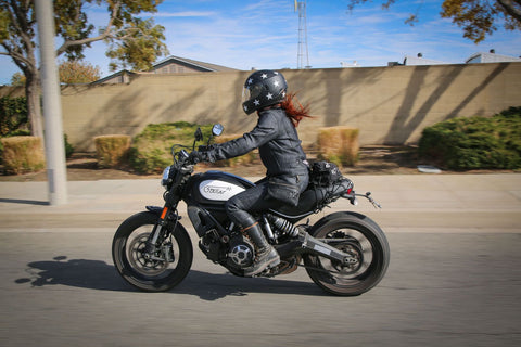 Female motorcyclist wearing protective gear