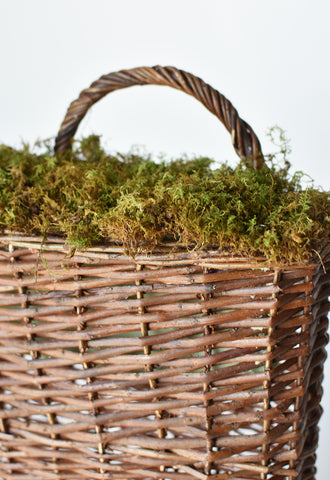 covered foam into basket with moss and pins to create arrangement in basket how to diy