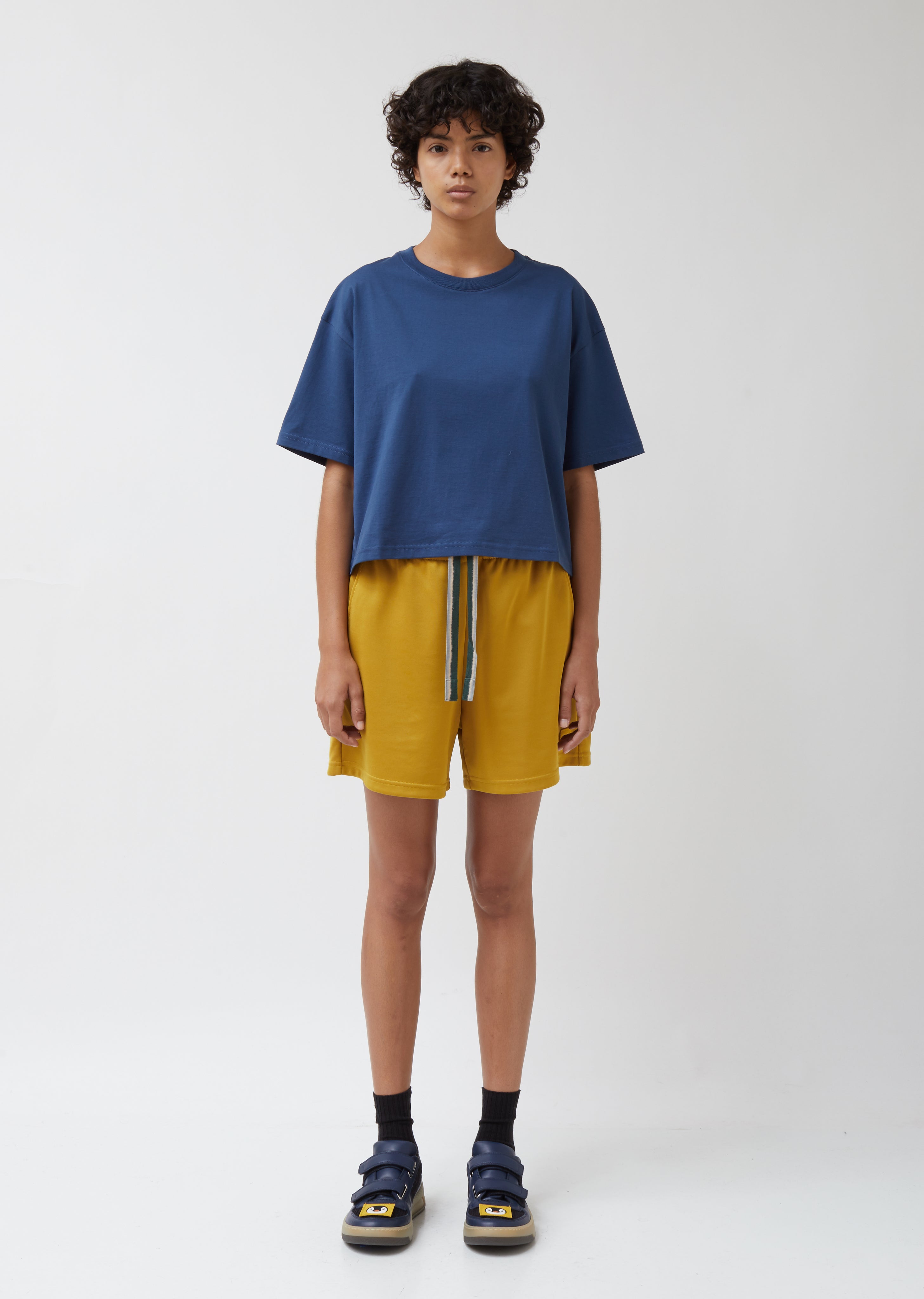 blue face yellow shorts