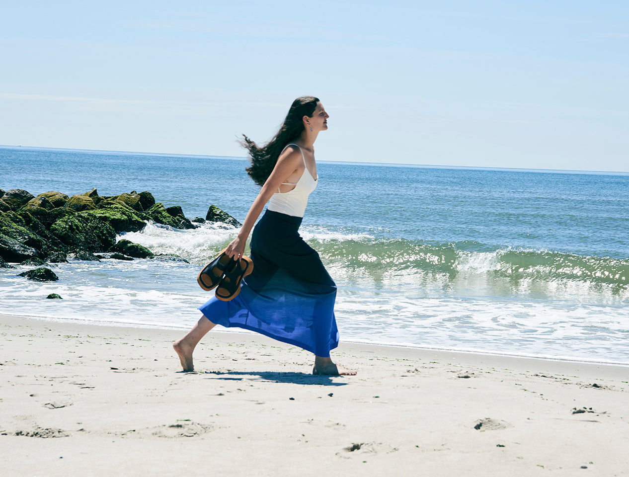 Ventiquattro V-neck One Piece by Lido; Olina Skirt by The Row; Stretch Rec Sandal by Proenza Schouler 