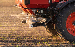 Tractor Spreads Fertilizer