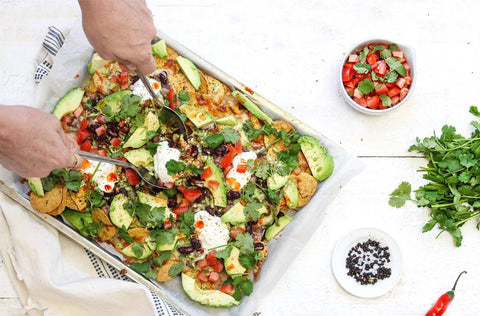 Green nachos with avocado, beef and beans