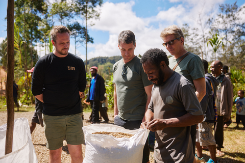 Sewing bags of coffee shut in Keefu Village, PNG