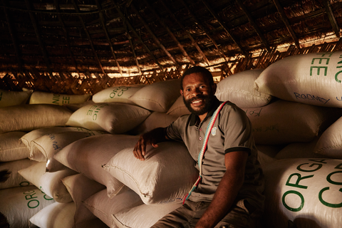 Hut in Keefu Village, PNG with bags of coffee