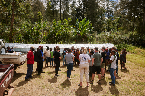 Group gather to look at raised drying bed