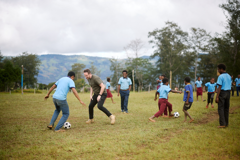 Nick playing football at Purosa Primary