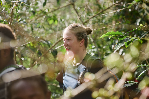 Caz picking coffee cherries