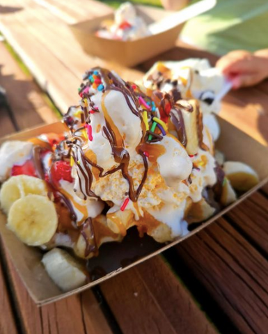 Waffles loaded with ice cream, sprinkles and banana slices