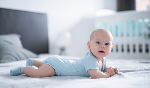 How can I prevent flat head syndrome in my newborn?