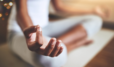 Woman meditating for emotional wellbeing  