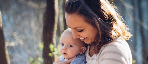 Smiling woman and baby