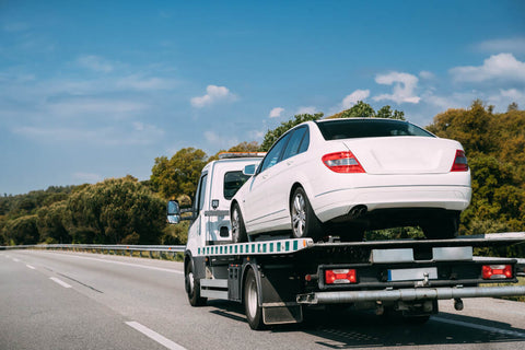 Car on flatbed work truck