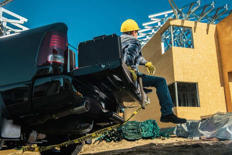 Contractor Sitting on His Pickup Truck Cargo Beds