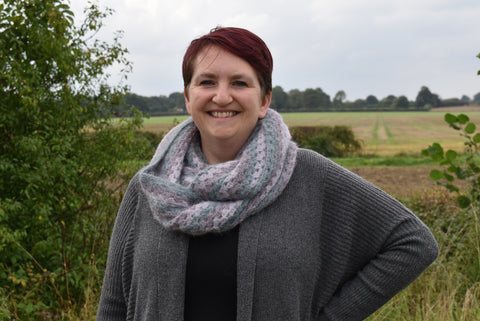 Portrait of a woman wearing a fluffy crocheted cowl