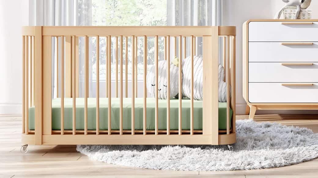 nursery room with modern crib and dresser