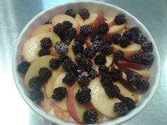 Peaches and blackberries in dish, ready for Singing Bowl NO GRAIN Granola topping.