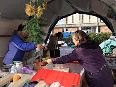 Serving hot porridge at Victoria's Tent City