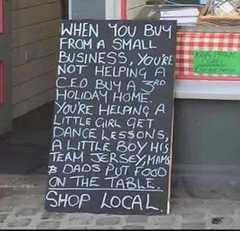 Sign explaining why you should shop local
