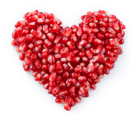 pomegranate seeds in the shape of a heart 