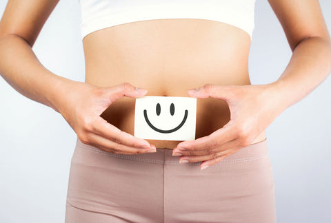 woman holding a smile over her stomach