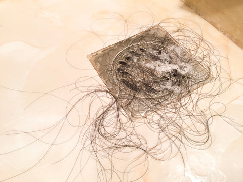 black hair in a shower drain