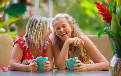 women drinking tea and laughing 