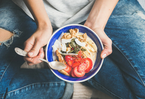 person holding nutritious bowl of food 