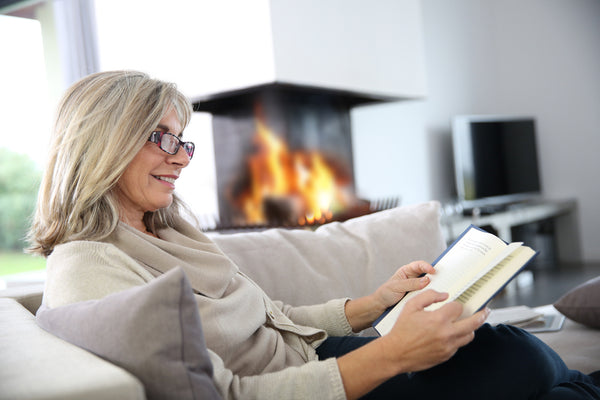 woman reading books about menopause