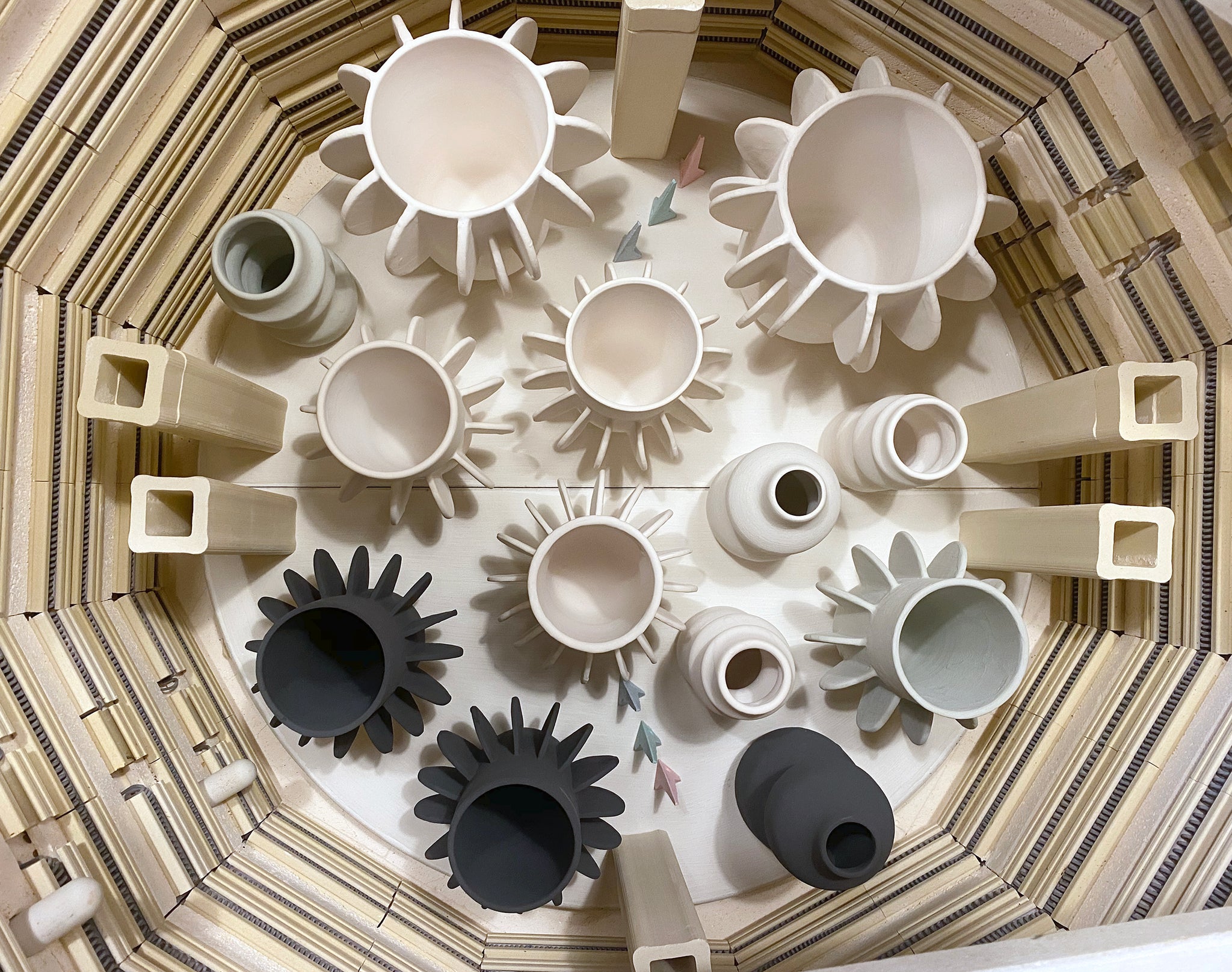 Image of Arc Ceramics pieces in a kiln. 