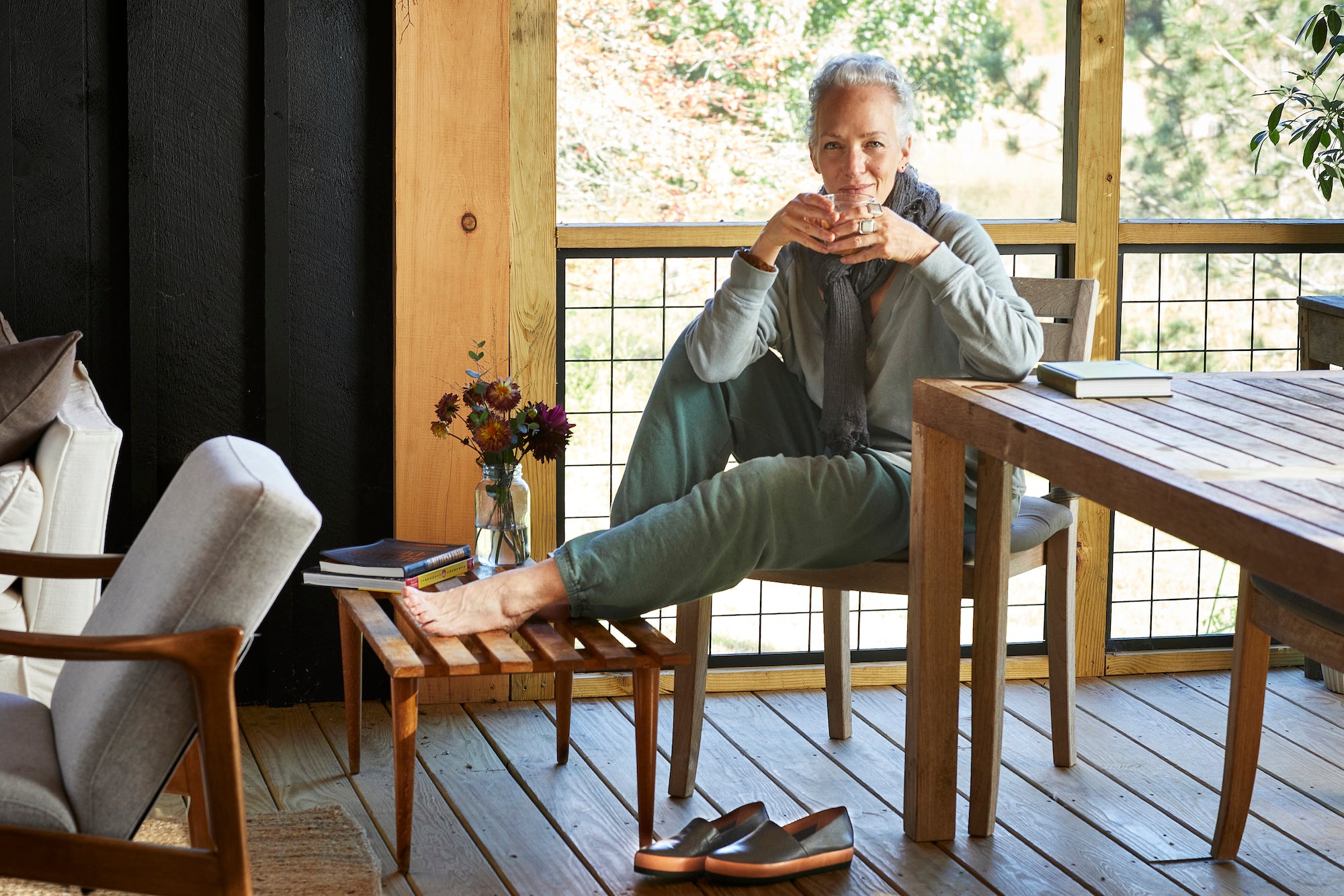 Image of Laura Chávez Silverman lounging on her deck.