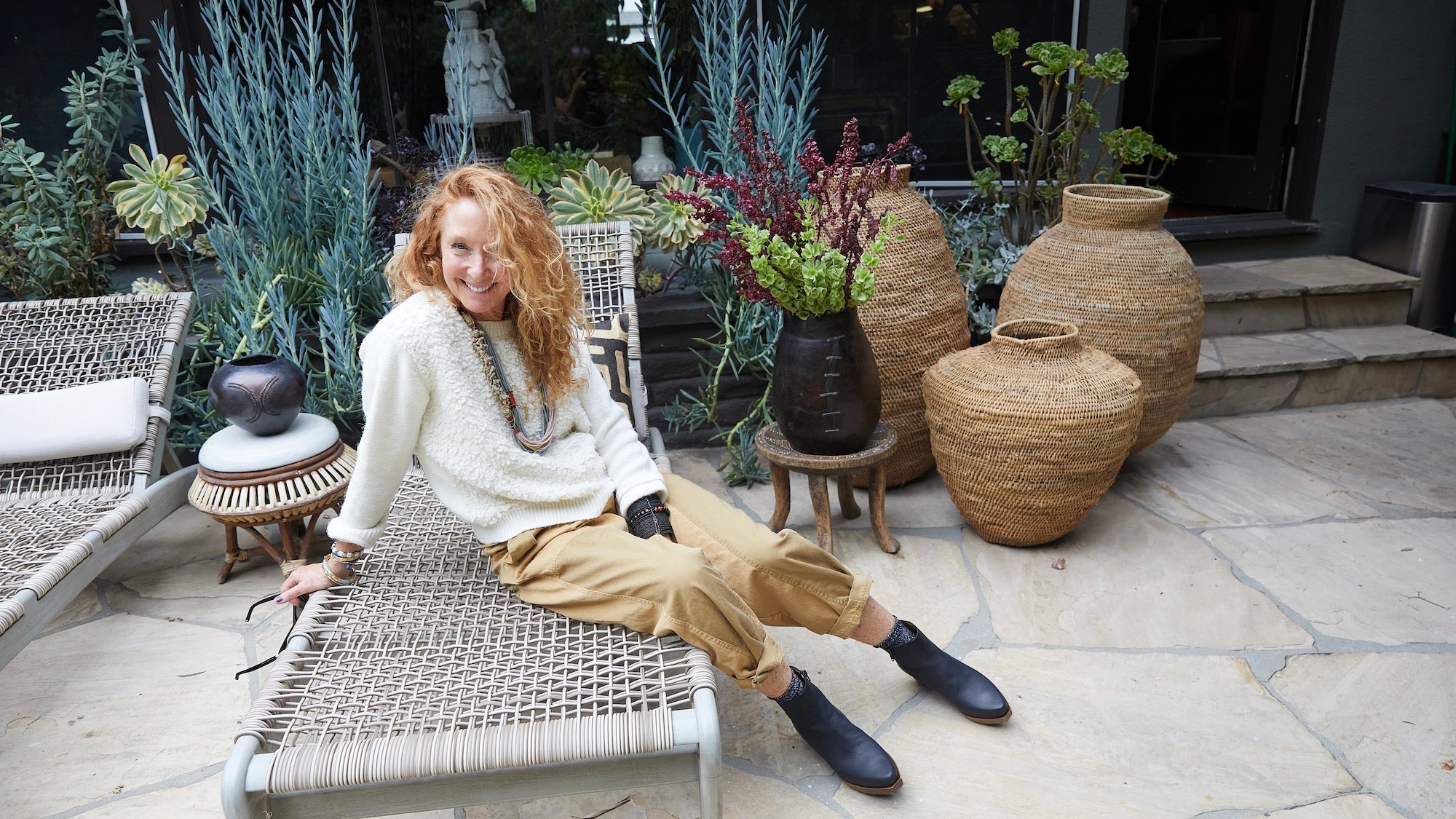 Image of Tracy Marsh Hoffman seated on a lounge chair wearing her Coclico favourites. 