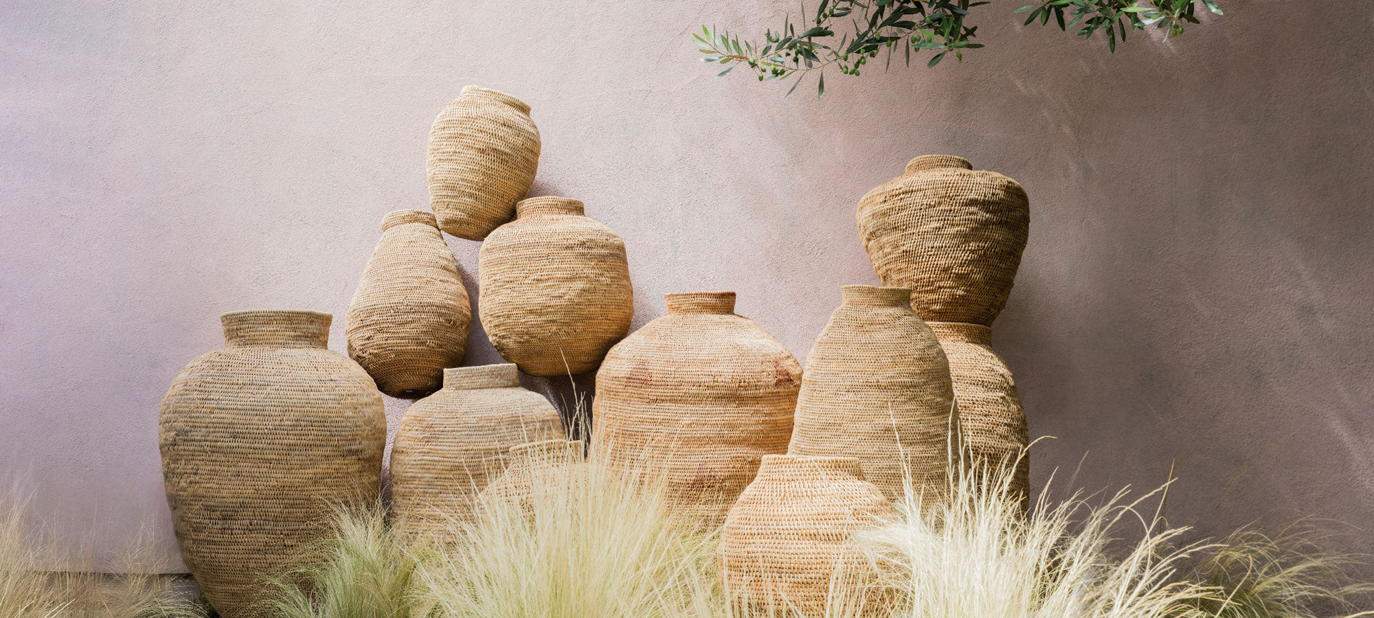 Image of stacked fair-trade, ethically sourced, artisan-made woven baskets. 