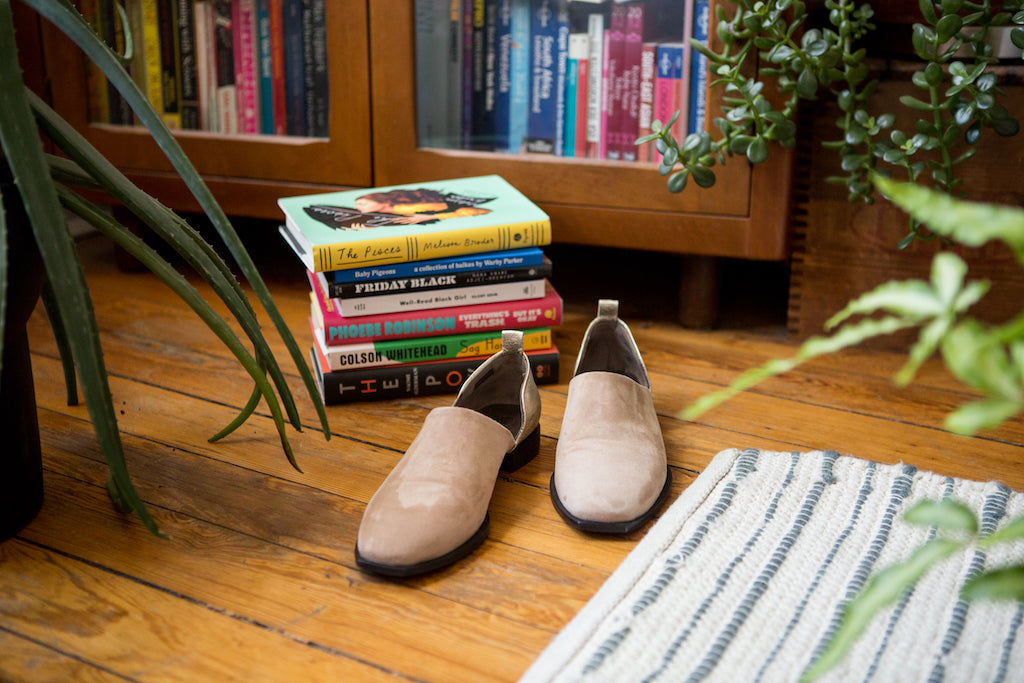 Stack of Uli Beutter Cohen's books besides her Suave Flats. 