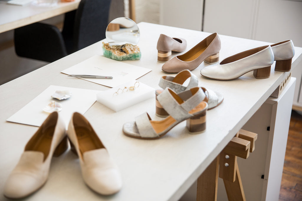 Image of Coclico styles scattered out on a white desk at WWAKE's Greenpoint headquarters.