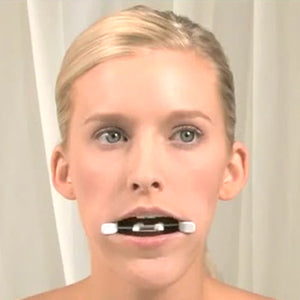 Facial Flex - Woman with Facial Flex in mouth