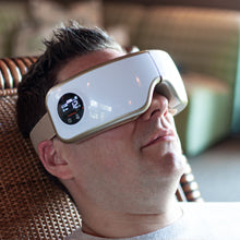 Man relaxes with the Body Sport Eye Massager