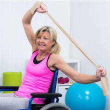 Woman in Wheelchair Using Body Sport Exercise Bands