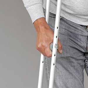 BodyMed Aluminum Crutches  - Man putting weight on crutches