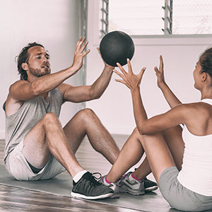 BodySport Slam Balls - Men throwing slam ball with each other