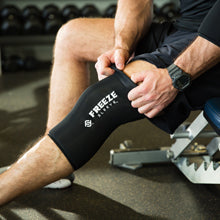 Freeze Sleeve Cold Therapy Compression Sleeve - close-up of pulling up freeze sleeve on over knee