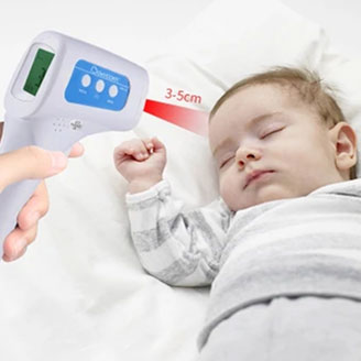 Mother taking babies temperature with Non-Contact Infrared Thermometer