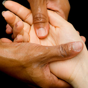 HobaCare Jojoba - Pair of hands getting massage