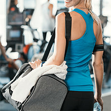 BodyMed Resistance Loop Tube - woman carrying a gym bag